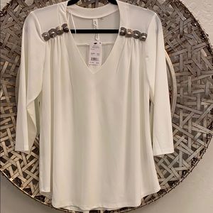 V-neck blouse with just the right amount of bling